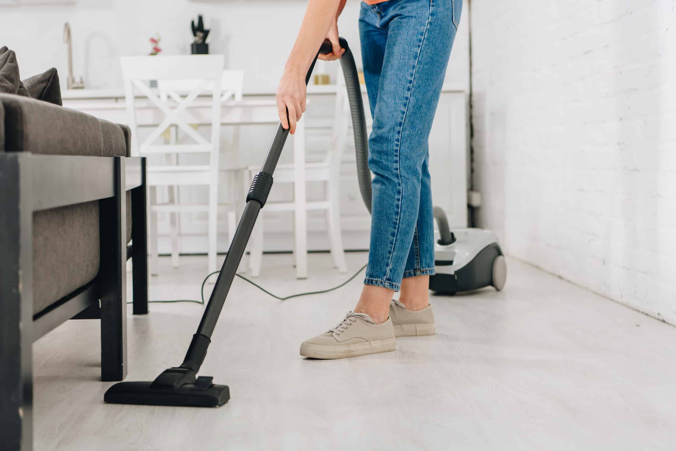 Woman cleaning the floor of her home