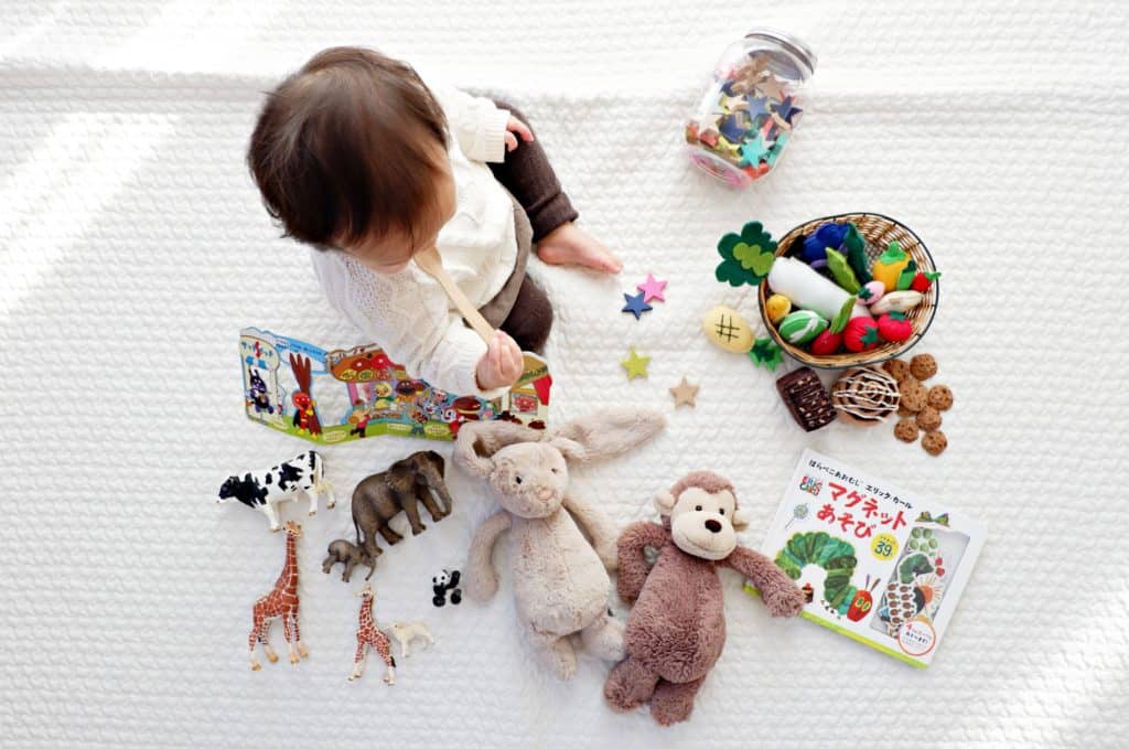 Young toddler playing with sustainable toddler toys